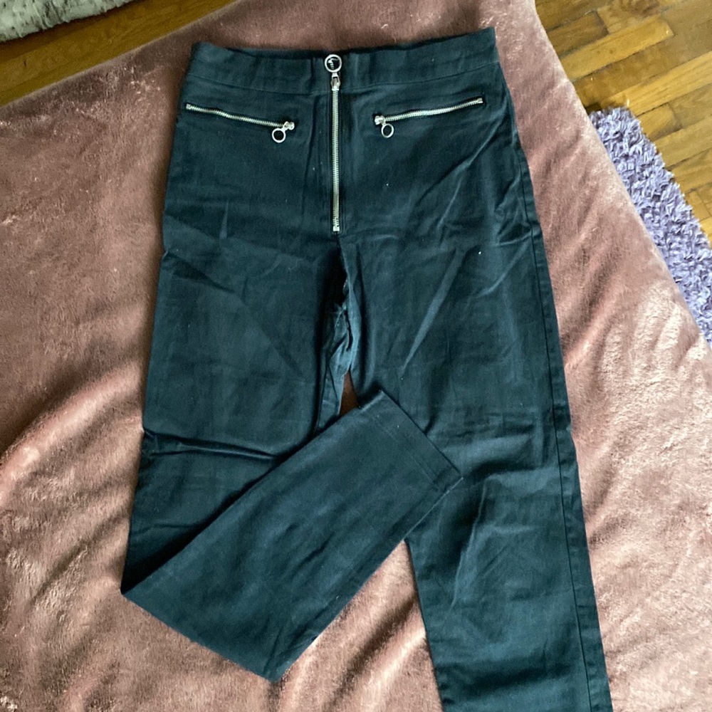 Fitted black pants with zipper details